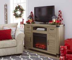 a living room decorated for christmas with presents