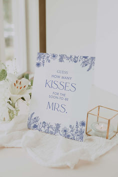 a card that says guess how many kisses for the soon to be mrs on it