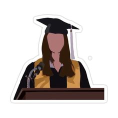 a woman wearing a graduation cap and gown at a podium with a microphone in front of her