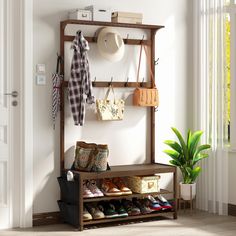 a coat rack with shoes, purses and hats on it next to a potted plant