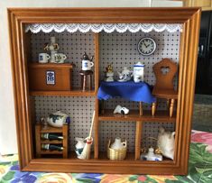 there is a miniature doll house with many items in it