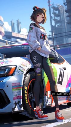 a woman standing on top of a car in front of a race track with her hands on her hips