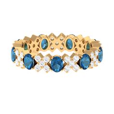 a gold bracelet with blue and white stones on the front, set in 18k yellow gold