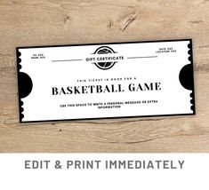 a basketball game ticket sitting on top of a wooden table