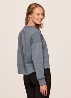 Our In The Studio Cropped Pullover combines a classic crewneck design and super soft, trendy scuba fabric for a lightweight pullover you can take from studio to street. A slightly cropped length is complemented by a relaxed fit, dropped shoulders and sporty seaming detail that allow for easy styling and layering. Throw this cute crop sweatshirt over a sports bra for a workout or pair it with jeans for a casual-cute look. Cropped Pullover, Scuba Fabric, Crewneck Design, A Workout, In The Studio, Crop Sweatshirt, The Studio, Drop Shoulder, Layering