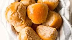 a basket filled with rolls on top of a table