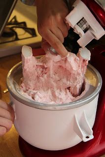 someone is using a blender to make something pink