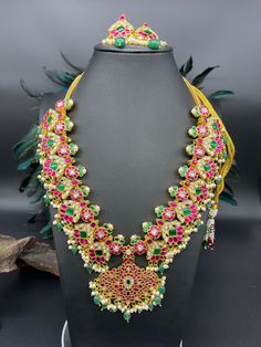 Jadau kundan fusion Necklace/choker with earrings in brass to make your occasion dazzle!   Handcrafted  Ethnic Kundan Necklace and matching Earrings Set. * It's made from Brass n Copper Pink, green and White Multi color Kundan Stones Settings with 22 ct gold Plating on Jadau motifs.  Occasion to wear: Party, wedding, marriage, kitty parties and any special occasion. *Handcrafted with care by happy hands and full hearts by world class artisans across India. Fusion Kundan Necklace With Latkans, Fusion Style Kundan Necklace With Latkans, Pink Temple Jewelry Necklace For Festive Occasions, Pink Temple Jewelry Necklace For Festivals, Pink Temple Necklace For Festive Occasions, Pink Temple Jewelry For Ceremonial Occasions, Pink Ceremonial Temple Jewelry, Festive Pink Temple Necklace, Pink Kundan Temple Necklace For Festivals