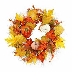 a wreath with pumpkins, leaves and acorns