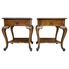 two wooden end tables with one drawer and the other on casteors, both side by side