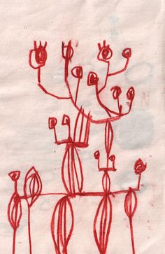 a drawing on paper with red lines and flowers in the middle, sitting next to each other