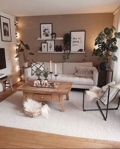 a living room filled with furniture next to a white rug and wooden table in front of a window