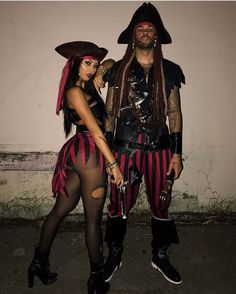 a man and woman dressed up as pirates