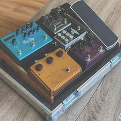 an assortment of different pedals in a case