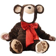 a brown teddy bear with a red bow