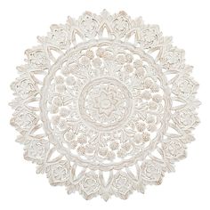 an intricately designed white plate on a white background