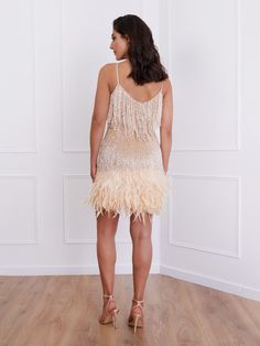 Glamorous Sleeveless Flapper Dress For Club, Glamorous Fringed Flapper Dress For Clubs, Glamorous Fringe Flapper Dress For Club, Glamorous Summer Flapper Dress For Club, Glamorous Flapper Dress With Feather Trim For Party Season, Glamorous Summer Club Flapper Dress, Cocktail Mini Dress With Fringe For Party Season, Glamorous Feather Trim Flapper Dress For Party Season, Glamorous Fringe Club Dress