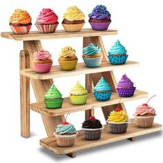 three tiered wooden cupcake display with various colored cupcakes on each shelf