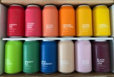 a box filled with lots of different colored drinks