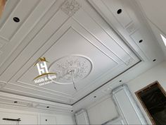 the ceiling is painted white and has gold trimmings on it's sides