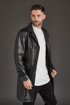 Men's Trench Leather Coat In Black Introducing our men's trench leather coat in black, a must-have for any fashion-forward wardrobe. This coat is meticulously crafted from high-quality sheepskin leather with a semi-aniline finish, ensuring both elegance and durability. Featuring a button closure, turn-down collar, and open hem cuffs, it provides a sophisticated silhouette. Complete with two inside pockets and two side pockets, this coat combines functionality with a sleek, timeless design. Outer Shell: Genuine Leather Leather Type: Sheepskin Leather Finish: Semi-aniline Closure Style: Button Collar Style: Turn Down Cuffs Style: Open Hem Inside Pockets: Two Outside Pockets: Two Side Pocket Color: Black Leather Trench Coat Mens, Sleek Long Leather Coat, Long Black Leather Trench Coat, Goth Trench Coat For Men, Men’s Leather Trench Coat, Leather Shorts Women, Leather Trench Coat Goth, Short Leather Skirts, Mens Leather Coats