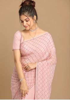 Be the cynosure of all eyes at any gathering with this glistening, beautifully dusty pink saree from the house of . Crafted in premium chinon silk for unmatched sheen, soft comfort and superb drape, it comes along with a fabulous blouse piece and can grace many an occasion with elan through its fashionable, modern statement. Pair it with a simple pearl necklace to enhance its beauty. Pattern Pearls and stone Wash Dry clean only Color Dusty Pink Model fit This is free size garment Fabric Chinon Pink Blouse With Mirror Work For Eid, Glamorous Pink Pre-draped Saree With Mirror Work, Pink Chinon Pre-draped Saree For Eid, Elegant Pink Blouse Piece For Party, Elegant Pink Party Blouse Piece, Eid Pink Blouse Piece With Mirror Work, Pink Georgette Blouse With Dori Work, Pink Unstitched Pre-draped Saree With Mirror Work, Pink Blouse Piece For Reception