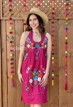 This Beautiful Halter Dress boasts a Traditional Mexican floral design combined with a modern style dress. It's made out of fine Mexican cotton, has ties around the neck and has elastic on the back for a tighter fit. It has hand embroidered flowers and hand knit details throughout. This dress is handmade by Mexican Artisans in Mexico. Note: Since this dress is Hand embroidered the embroidered colors on each dress vary, making them one of a kind. Pink Fitted Dress For Festival, Pink Fitted Dress For Fiesta, Summer Fiesta Dresses With Embroidered Neckline, Fitted Pink Embroidered Dress, Fitted Sleeveless Dress For Fiesta, Summer Sleeveless Dress With Multicolor Embroidery, Sleeveless Multicolor Embroidered Maxi Dress For Summer, Spring Fiesta Dress With Embroidered Neckline, Bohemian Sleeveless Embroidered Dress For Party