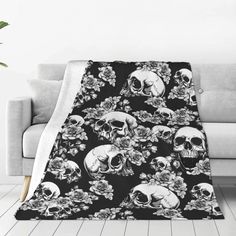 a black and white blanket with skulls on it