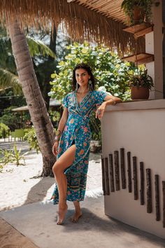 Be the foremost authority in comfy fashion with the Joseph Bohemian Wrap Maxi Dress! This dress gets a dose of chic-ness & femininity with its fit & flare silhouette in full bohemian allure. Perfect for garden parties paired with your fav sandals. Specs:  ﻿Material: Cotton, Rayon Turquoise Boho Dress For Spring Vacation, Bohemian Turquoise Maxi Dress For Summer, Turquoise Boho Print Dress For Beach, Turquoise Boho Print Beach Dress, Turquoise Bohemian Dress For Beach Season, Fitted Boho Dress With Boho Print For Vacation, Fitted Boho Dress With Print For Vacation, Fitted Bohemian Midi Dress For Summer, Turquoise Bohemian Beach Dress