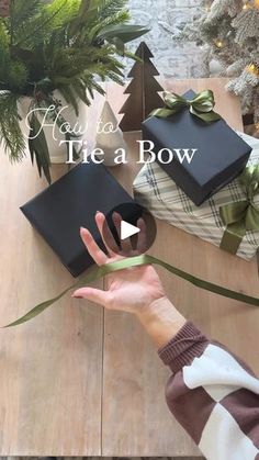 someone is holding out their gift box with the words may you tie a bow on it