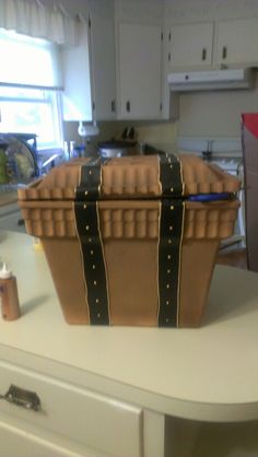 a large brown basket sitting on top of a counter