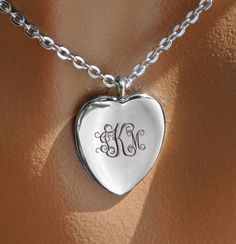 "This personalized elegant silver heart necklace can be custom engraved on both sides of the heart pendant. Our silver heart necklace can be engraved with initials or a name for that someone special. This personalized heart charm makes a great gift for Valentine's day or Anniversaries and is also great as a wedding gift for your flower girl or bridesmaids. Silver Elegant Heart Necklace Heart: 0.6\" x 625\" Material 316 Surgical Stainless Steel How To Send Engraving Instructions: When you are rea Necklace Elegant, Silver Heart Pendant, Necklace Heart, Silver Heart Necklace, Engraved Necklace, Bridesmaid Gift, Necklace Silver, Name Necklace, Silver Heart