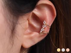 Available in 3 colours ✦ 18k gold plated ✦ Rhodium plated ✦ 18k rose gold plated Quality & Detail ✦ Ear cuff : Your ears don't have to be pierced to wear this product. ✦ Fits any ear as it is adjustable. ✦ The height 16.2mm ✦ The width 10.3mm ✦ Cubic zirconia size 5mm ✦ Pearl size 2mm ✦ Sold individually : Comes in a cute little package ready for gifting Shipping from United Kingdom Jewellery Dainty, Wrap Earrings, Ear Cuffs, Cuff Earrings, Pearl Size, Gold Plated Silver, 18k Rose Gold, Rose Gold Plates, Rhodium Plated