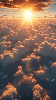 the sun is setting over some clouds