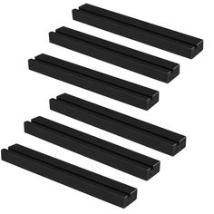 four black plastic shelfs are lined up against each other