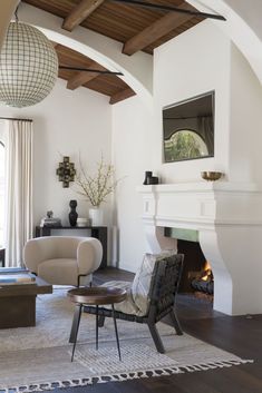 a living room with white walls and furniture