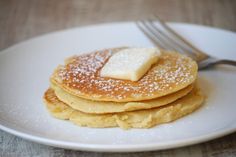 a stack of pancakes with butter on top