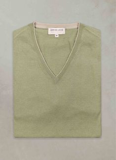 Indulge in our buttery-soft Cashmere/Extrafine Extra Lightweight Merino V-neck sweaters. Made with 2 twisted plies of the finest blended yarn, this garment is extremely versatile--perfect for wearing under a sportcoat--without any constraint in motion--or simply wear outdoors in spring or summer. This light garment features thoughtful details throughout, such as a 1/8” contrast at the inside edge of the collars and at the tip of the wrists. The cashmere originates from Arbas cashmere goats from Turtleneck Hoodie, Perfect White Shirt, St Barths, Hoodie Cardigan, Business Casual Dresses, Sport Dress, Business Dresses, Womens Size Chart, Mongolia