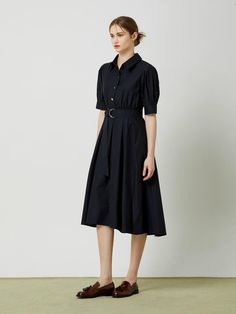 This belted flared long dress exudes a feminine and elegant style with its flared silhouette, shirring at the waist, and voluminous sleeves.- Long length that makes your outfit stylish- A-line silhouette to add appeal to the item- D-ring belt detail for added interest* The color of the actual product may vary due to differences in monitor color settings and resolution. Elegant Pleated Midi Dress With Voluminous Skirt, Chic Belted Shirt Dress For Evening, Elegant Midi Shirt Dress With Pleated Sleeves, Elegant Midi Length Shirt Dress With Belted Cuffs, Chic Pleated Puff Sleeve Midi Dress, Short Sleeve Belted Evening Dress, Spring Evening Belted Dress With Belted Cuffs, Belted Dress With Belted Cuffs For Spring Evening, Chic Shirt Dress With Gathered Sleeves For Work