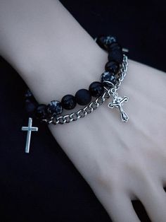 Elevate your gothic style with our handmade cross charm Gothic black beaded bracelet with chains. This edgy bracelet features intricate black beads and a striking cross charm, exuding a dark, mysterious allure. The addition of chains adds an extra touch of punk-inspired flair. Handcrafted with care, this bracelet is a unique statement piece that will add an element of intrigue to any outfit.   Please note that this product includes only the bracelet. Cheap Halloween Punk Bracelets, Sleep Token Bracelet, Punk Jewellery, Goth Beaded Bracelet, Punk Bracelets Diy, Dark Bracelet, Punk Bracelets, Goth Bracelets, Black Bracelet