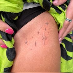 a woman's thigh with stars on it