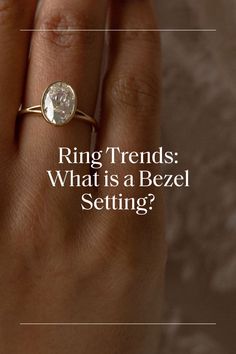 A bezel setting refers to a continuous rim of metal around the ring’s stone. The metal slightly overlaps the stone’s edges to secure it in place and accentuate its unique details. Ivory Ring, Ship Wedding, Matter Of Time, Cushion Engagement Ring, Ring Trends, Bezel Ring