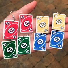 These adorable uno skip card earrings are available in all 4 colors and are made using nickel free and hypoallergenic earring hooks! If you order the surprise option, you will receive a pair of the card earrings, both a different color! Uno Skip Card, Thrift Flip Ideas, Card Earrings, Cool Earrings, Ears Pierced, Funny Jewelry, Goth Choker