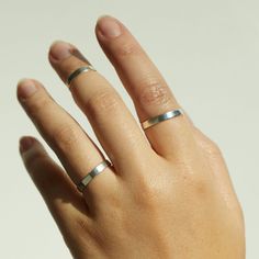 Our chunkiest stacking ring takes dainty and gives it a gentle punch in the face. (Gently!) Easy to wear and looks great on everyone! Also available in solid 14k yellow or rose gold, and in first knuckle (aka midi ring) sizes. Engraving available! All numbers, capital letters as well an ampersand (&) available, no other characters or punctuation. Engraving only available on outside of band. We are not able to offer custom fonts or characters. Knuckle Rings Silver, Punch In The Face, Sterling Silver Stacking Rings, Knuckle Ring, Midi Ring, Silver Stacking Rings, Knuckle Rings, Midi Rings, Custom Fonts