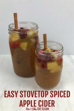 two mason jars filled with apple cider