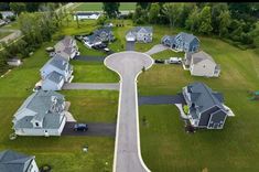 an aerial view of several houses and roads