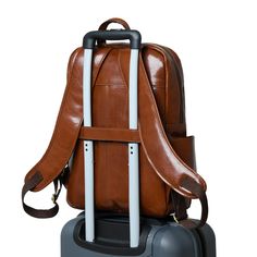 Make a bold statement with this head-turning Italian brown leather backpack that radiates confidence and style. The glossy finish enhances its vibrant color, creating a mesmerizing and eye-catching accessory. The sleek design and luxurious feel of the leather makes it a standout piece in any fashion ensemble, promising to elevate your look with a touch of glamour. Whether you're navigating city streets or making a grand entrance at an event, this bold and eye-catching brown leather backpack is t Brown Leather Backpack With Luggage Sleeve For On-the-go, Designer Brown Leather Backpack, Luxury Level, Luxury Brown Leather Backpack For On-the-go, Brown Leather Backpack With Trim For On-the-go, Brown Leather Backpack With Adjustable Strap For On-the-go, Waxed Canvas Bag, Brown Leather Backpack, Trolley Bags, Duffel Bag Backpack