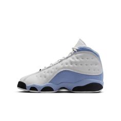 Throw it back with the AJ13, the shoe originally worn by MJ during his sixth championship season. A new colorway refreshes the legend with premium White tumbled leather and Blue Grey synthetic suede. Iconic details abound, like the unmistakable quilted overlay, panther paw-inspired outsole and holographic eye. Finishing it off, hits of Yellow Ochre make the classic branding pop. Nike Air unit in the heel provides lightweight cushioning. Full-grain leather, synthetic leather and textile in the up Classic Branding, Throw It Back, Black Throws, Red Puffer, Air Jordan 13 Retro, Jordan 13 Retro, Yellow Ochre, Retro Blue, Jordan 13