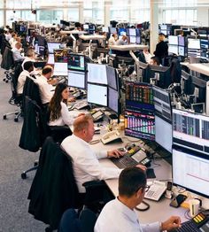 an office filled with people working on computers