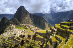 the ruins of machaca picach are surrounded by mountains